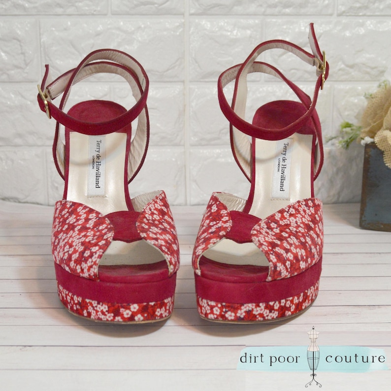 designer glam heels
terry de havilland
70s style platforms
vintage red heels
chunky heel vintage
rare velvet heels
retro peep toe shoe
red ankle strap heel
designer shoe
velvet platforms
peep toe shoes
floral heels
collector fashion