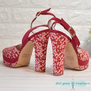 designer glam heels
terry de havilland
70s style platforms
vintage red heels
chunky heel vintage
rare velvet heels
retro peep toe shoe
red ankle strap heel
designer shoe
velvet platforms
peep toe shoes
floral heels
collector fashion