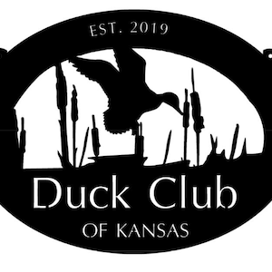 Metal sign with duck, cattail scene