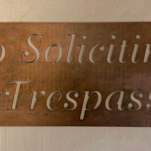 Metal  NO SOLICITING No TRESPASSING sign