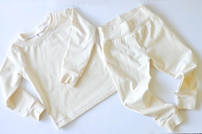 Flat lay of white organic cotton pajamas