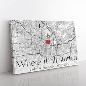 May include: A black and white map print with a red heart marking a location. The text "Where it all started" is displayed, along with the names "Jordan & Stephenie" and the date "05.09.2013".