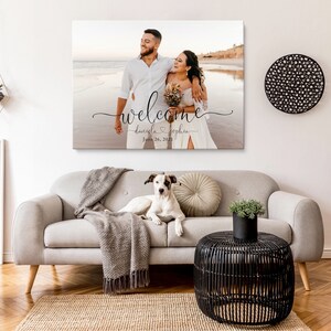 May include: A wedding welcome sign with a photo of a couple on a beach. The sign says "welcome" with the couple's names, "Daniela & Sophia", and the date "June 26, 2023".