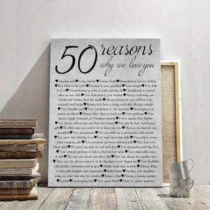 May include: A gray canvas print with the text "50 reasons why we love you" and a list of 50 reasons written in black text with heart symbols.