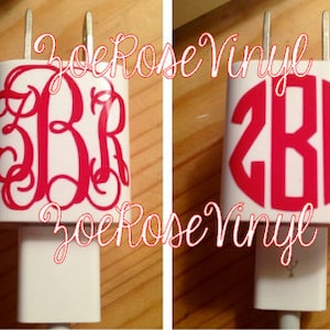 May include: Two white phone chargers with red monogram vinyl decals. The first charger has a monogram with the letters "BR" in a script font. The second charger has a monogram with the letters "ZBR" in a circle. Both chargers have the text "ZoeRose Vinyl" printed on them.