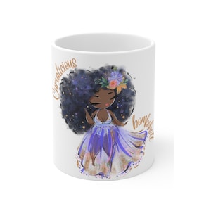 May include: White ceramic mug with a colorful illustration of a woman with an afro hairstyle wearing a purple dress and a flower crown. The text "Curvalicious Bombshell" is written on the mug in gold.