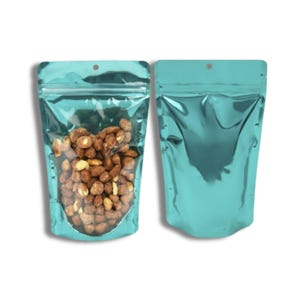 May include: Two teal metallic stand-up pouches with a zipper closure and a hanging hole. One pouch is filled with roasted peanuts.