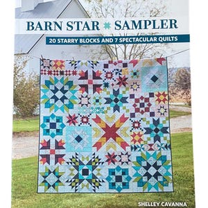 May include: A book cover titled "BARN STAR SAMPLER" with a colorful quilt design. The quilt features various star patterns in shades of blue, red, yellow, and green. The cover also states "20 STARRY BLOCKS AND 7 SPECTACULAR QUILTS" and the author's name, SHELLEY CAVANNA.