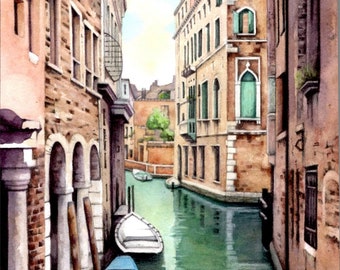 May include: Watercolor painting of a Venetian canal scene. Buildings with arched windows and green shutters line the canal. A blue boat and a white boat are docked. The water is a light green color. The sky is a light blue.