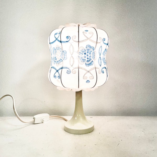 Cute German 1970s mid century white plastic table lamp with embroidery on fabric shade and lace details - design by Aro Leuchte
