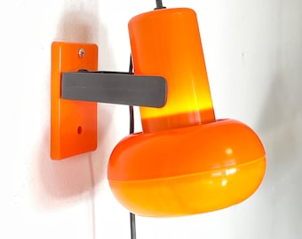 Cool Danish mid century orange plastic wall lamp with adjustable shade and great details - design by Lyskær Belysning, Denmark