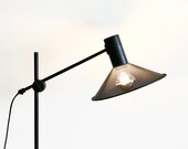 Original mid century modern Danish floor lamp in perforated metal with black paint and adjustable shade