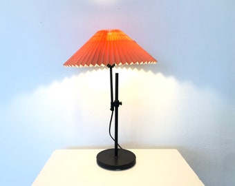 Danish modernist table lamp with heavy black painted iron base and cute coral pleated vintage fabric shade