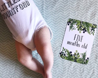 Cartões de marco para bebês com design de folhagem
