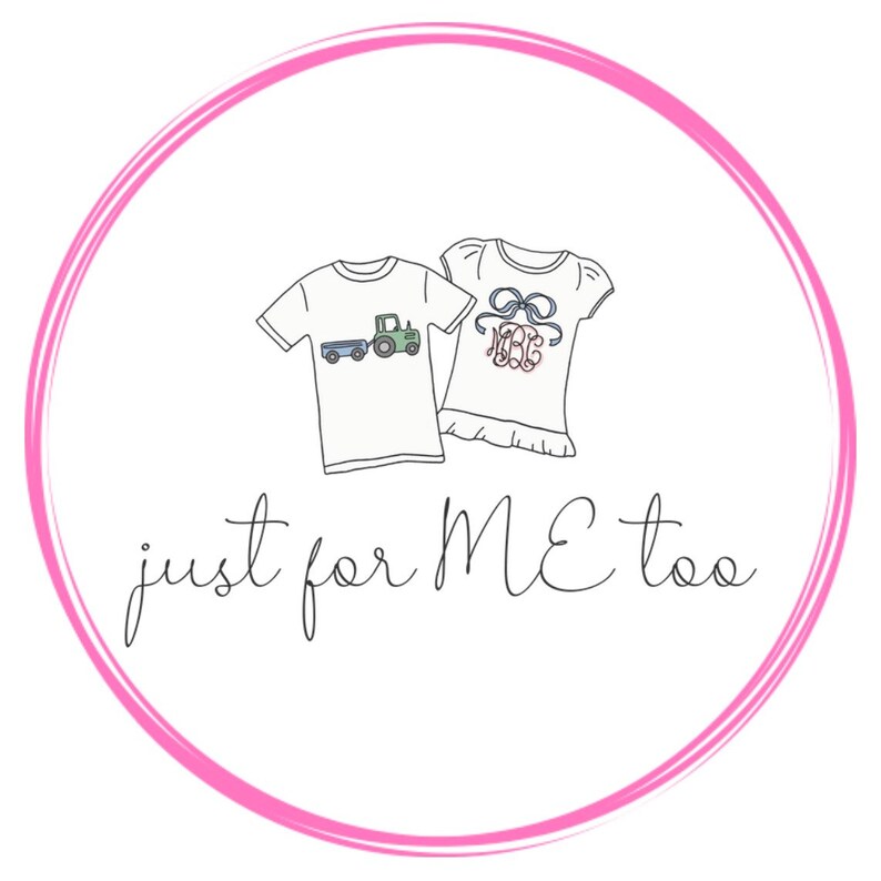 May include: A pink circle with a white background and the text "just for ME too" in black cursive. Inside the circle are two white t-shirts, one with a blue, green, and yellow tractor design and the other with a pink and blue monogram.