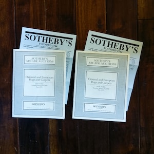May include: Two Sotheby's auction catalogs for Oriental and European Rugs and Carpets. The catalogs are dated March 22, 1980 and March 22, 1988. The catalogs are both titled "Sotheby's Arcade Auctions".
