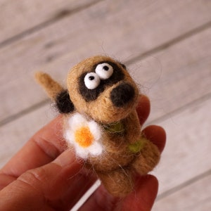 Needle felted meerkat with a small flower image 4