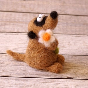 Needle felted meerkat with a small flower