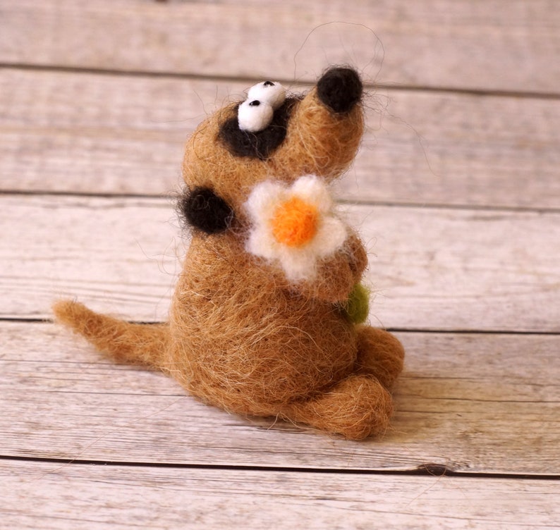 Needle felted meerkat with a small flower image 1