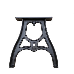 May include: Black cast iron table base with a decorative design. The base is marked "MADE IN USA" and "10-10".