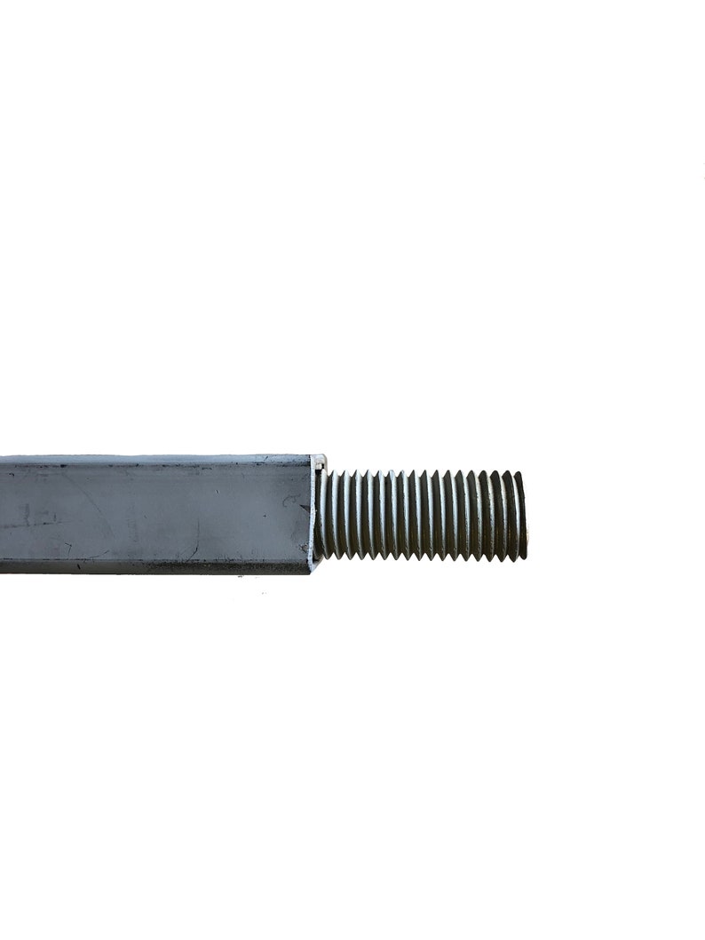 May include: A silver metal rod with a threaded end. The rod is square in shape and has a smooth, slightly textured surface.