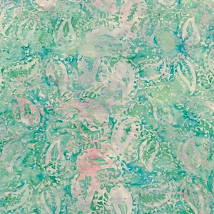 May include: A teal blue fabric with a white paisley pattern. The fabric has a light pink watercolor effect.