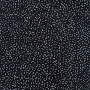 May include: Dark blue fabric with a pattern of small, irregular, light gray shapes. The fabric is evenly covered with the shapes, creating a textured appearance. The image includes a ruler along the edges, indicating measurements.