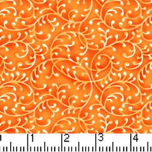 May include: Close-up of orange fabric with a repeating pattern of white and gold swirling vines and leaves. The fabric has a textured appearance, with the design slightly raised. The pattern is evenly spaced across the surface.