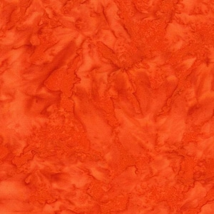 May include: Close-up of orange fabric with a textured, mottled pattern. The fabric has a batik-like appearance, with variations in the orange hue creating a sense of depth and visual interest. The material appears to be cotton or a similar woven textile.