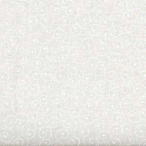 May include: White fabric with a repeating pattern of swirling, scroll-like designs. The fabric has a subtle texture and a ruler along the bottom edge, with measurements in inches.