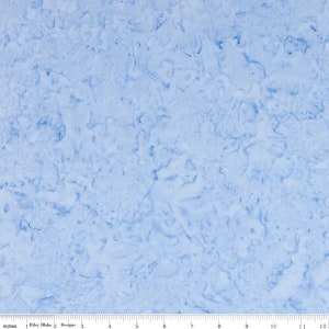 May include: A light blue fabric with a marbled pattern. The fabric has a subtle texture and a soft, faded look.