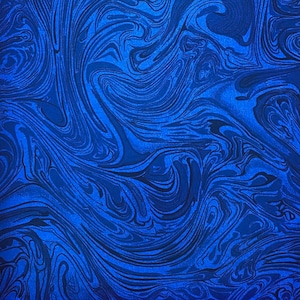 May include: Blue and black marbled fabric with a swirling pattern.