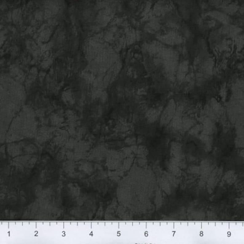 May include: A dark gray fabric with a marbled pattern. The fabric has a subtle texture and a slightly distressed look.