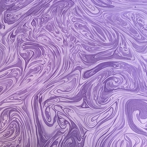 May include: Purple and white marbled fabric with a swirling pattern.