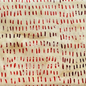May include: Cream-colored fabric with a repeating pattern of vertical red dashes. The dashes vary in size and intensity, creating a textured appearance. The design is reminiscent of hand-painted or stamped elements.