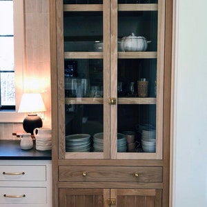 White Oak kitchen storage hutch glass doors