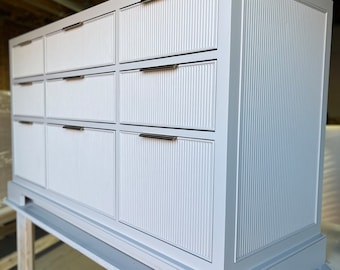 Custom built to order bathroom vanity, reeded fronts, maple dovetail drawers softclose.