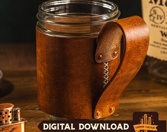 May include: A clear glass jar mug wrapped in a textured brown leather sleeve. The leather is secured with a vertical cross-stitch pattern and four metal rivets attaching the handle. The text DIGITAL DOWNLOAD is visible at the bottom of the image.