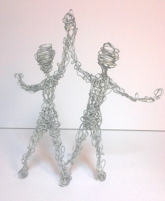 Gemini Two Aluminum Wire People Holding Handsglows In The Dark