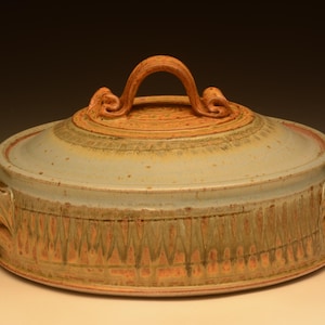 May include: A set of three ceramic mugs with a speckled, matte finish. The mugs are in shades of cream, light gray, and dark gray. Each mug has a simple, minimalist design, perfect for coffee or tea.