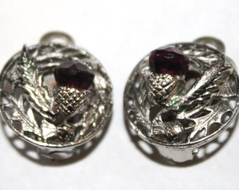 Thistle clip on earrings, round silver tone metal with purple colour stone