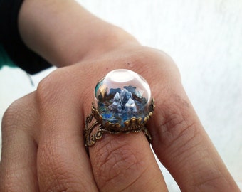 Miniature, highly detailed three dimensional landscape in a real glass dome, adjustable brass ring.