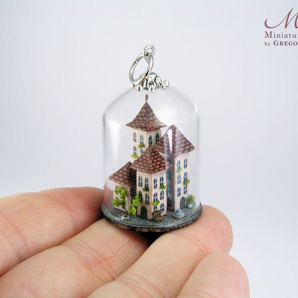 Miniature town in a clear glass dome, exquisitely and richly detailed