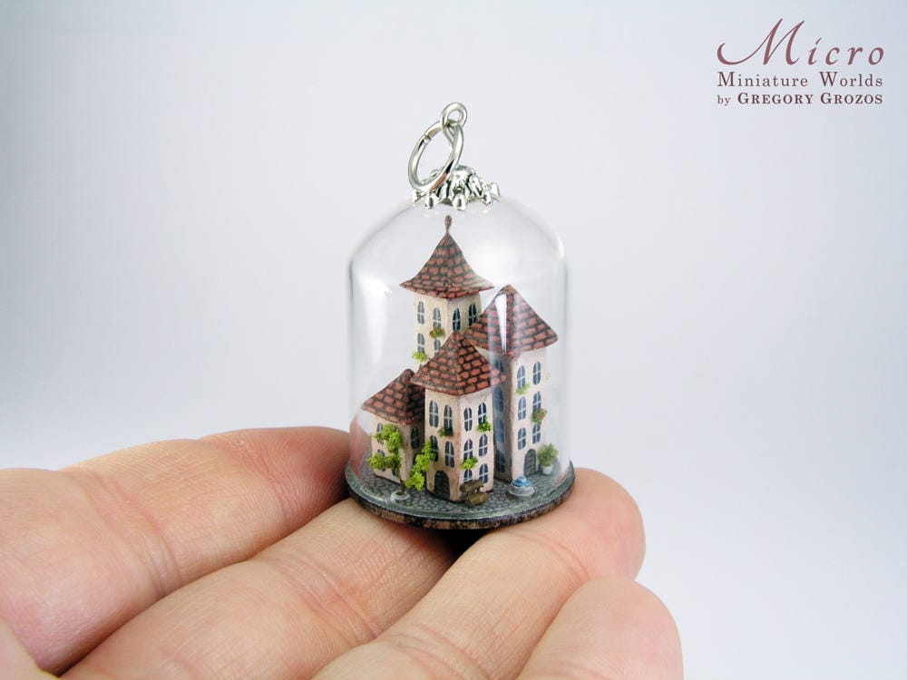 Miniature town in a clear glass dome, exquisitely and richly detailed