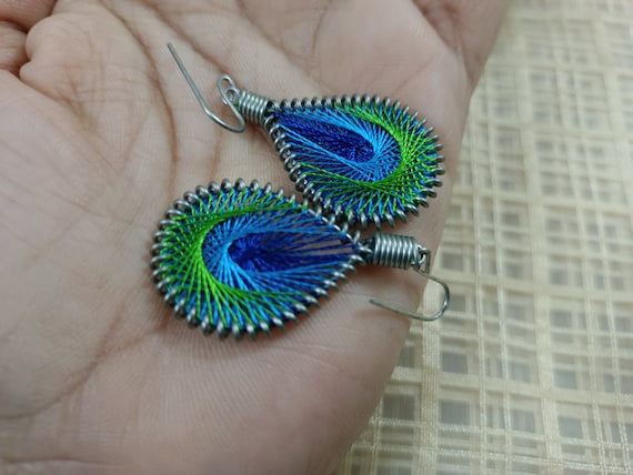 Buy Blue Designer Extra large Silk Jhumkas enhanced with a Peacock Stud  Online! – Khushi Handicrafts