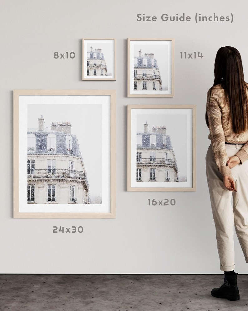 May include: Four framed prints of a building facade with a light-coloured exterior and a blue roof. The prints are displayed in various sizes: 20x25 cm, 28x35 cm, 40x50 cm, and 61x76 cm. The frames are light-coloured wood.
