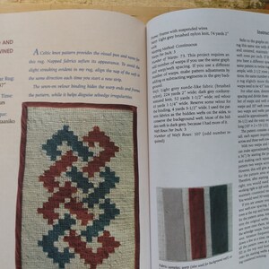 May include: A close-up of a book page showing a rug weaving pattern with instructions for a rectangular rug measuring 25 inches by 37 inches. The rug is made with a Celtic knot pattern and uses a variety of colors, including red, blue, and white.