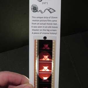 May include: A strip of 35mm motion picture film from the movie "A Clockwork Orange" (1971). The film strip features a close-up of the main character's face. Hold the film strip up to the light to see the image.