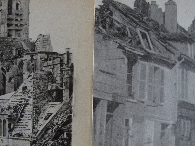 May include: A black and white photograph of a building with a damaged roof. The building is located in a city and has a tall tower in the background.