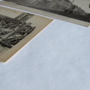 May include: Black and white vintage postcard depicting a damaged building with a tall tower. The postcard features text in French.